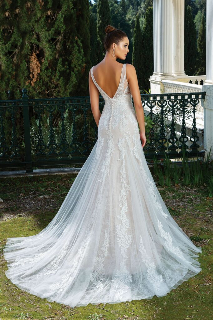 This stunning lace wedding dress with a V-back has everything a bride could want.