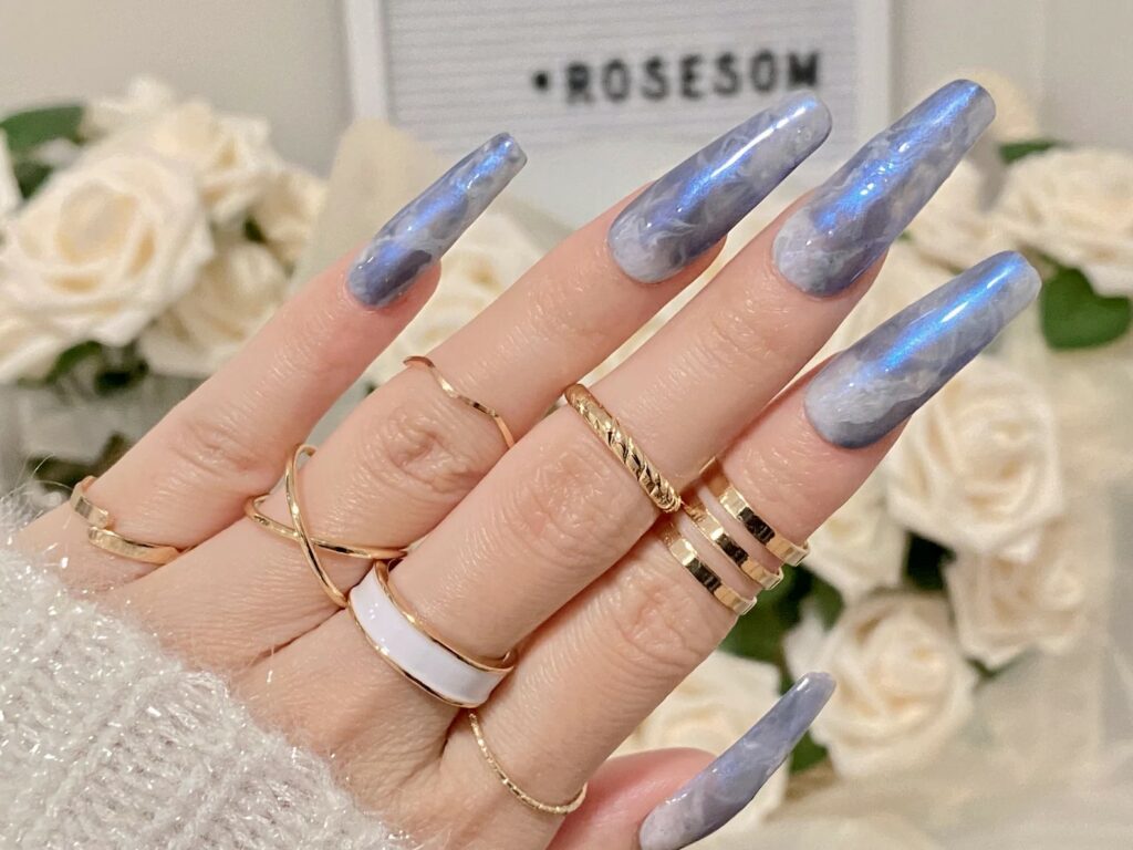 Blue ombre wedding nails look stunning on the hands of the bride with any kind of wedding dress.