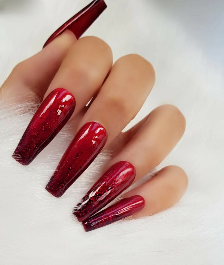 Brides who want to stand out in a crowd often choose ombre red wedding nails.