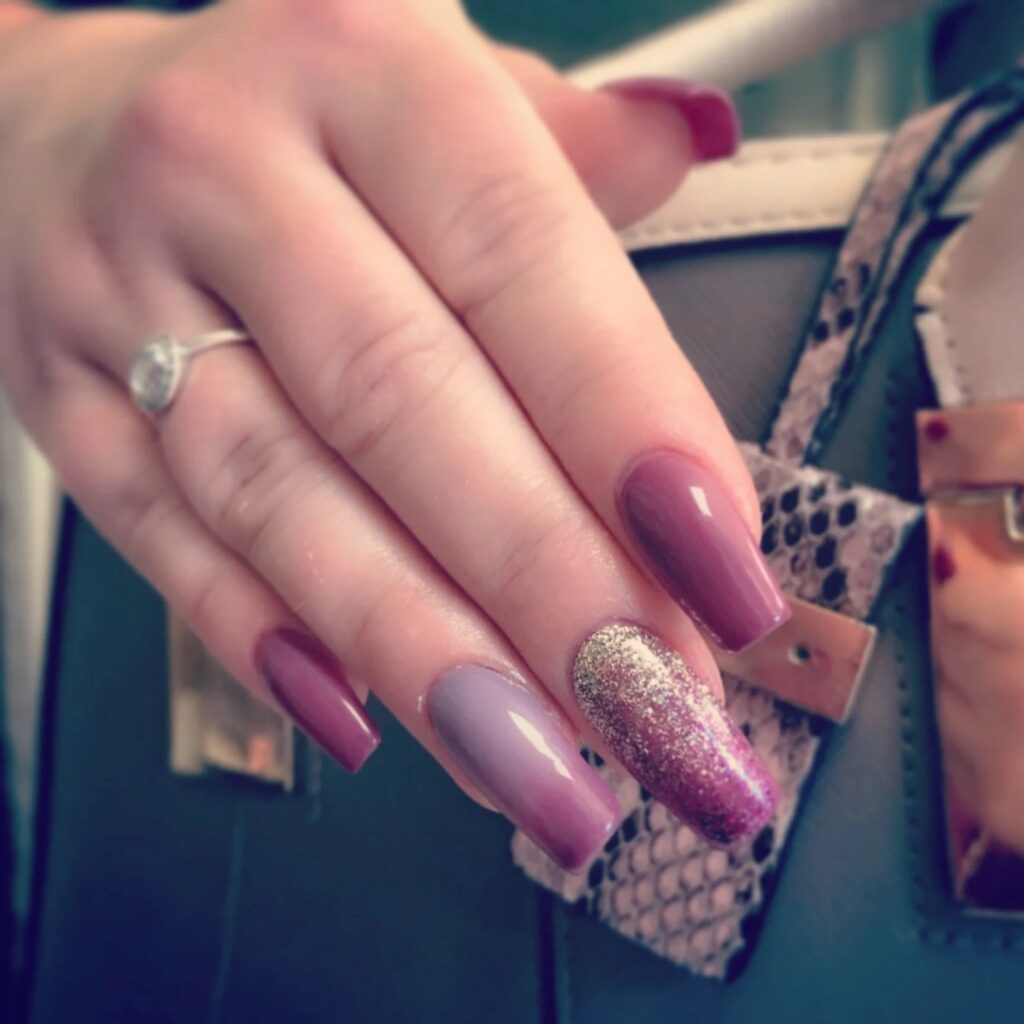 Glittery berry ombre bridal nails with a gel top coat are a stylish addition.