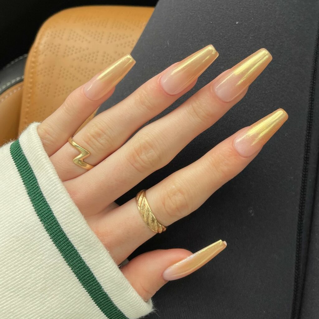 Gold ombre wedding nails are a beautiful addition to any brides outfit.