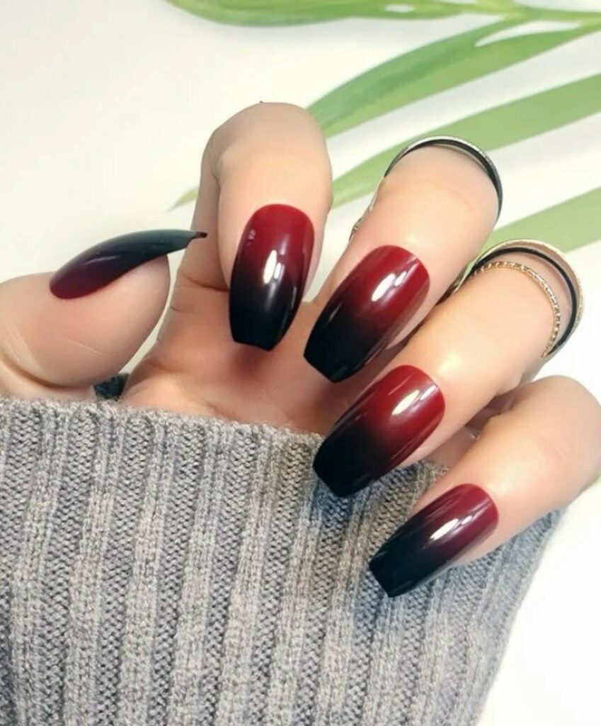 To look stylish paint your ombre nails a fire engine red tone with a blackened cuticle.