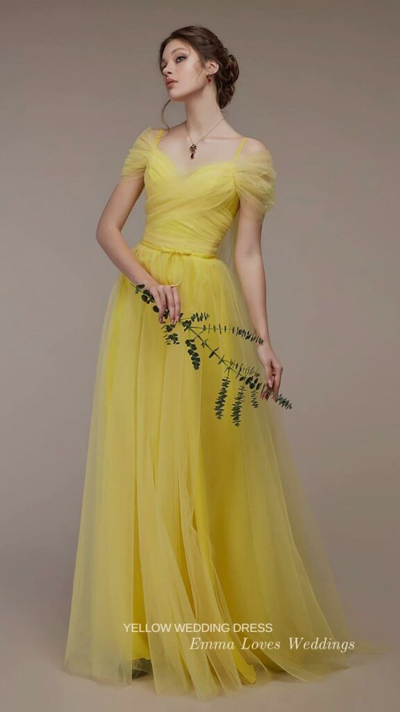 A yellow A-line wedding dress with chiffon is a great idea for a chic bride