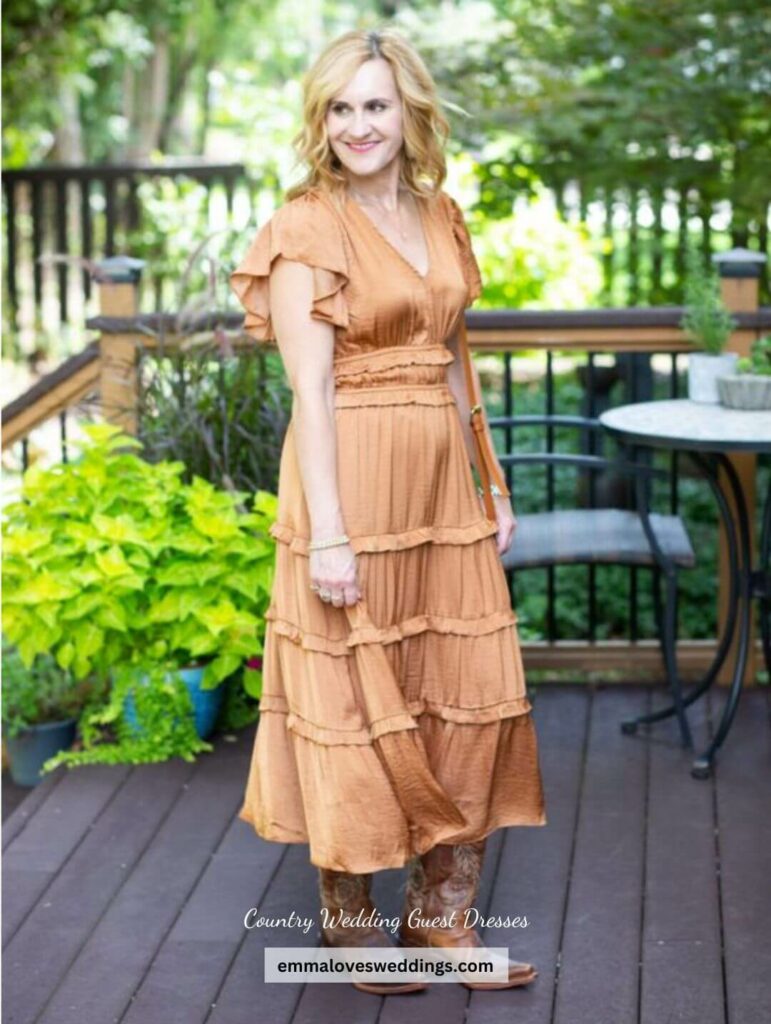 This pleated wedding guest dress is perfect for a rustic country wedding and looks great with a pair of cowboy boots.