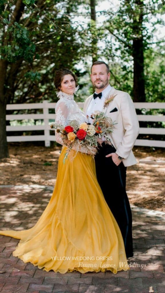 A lovely idea for a fall bride is a high neck wedding dress in yellow and white with vibrant flowers.