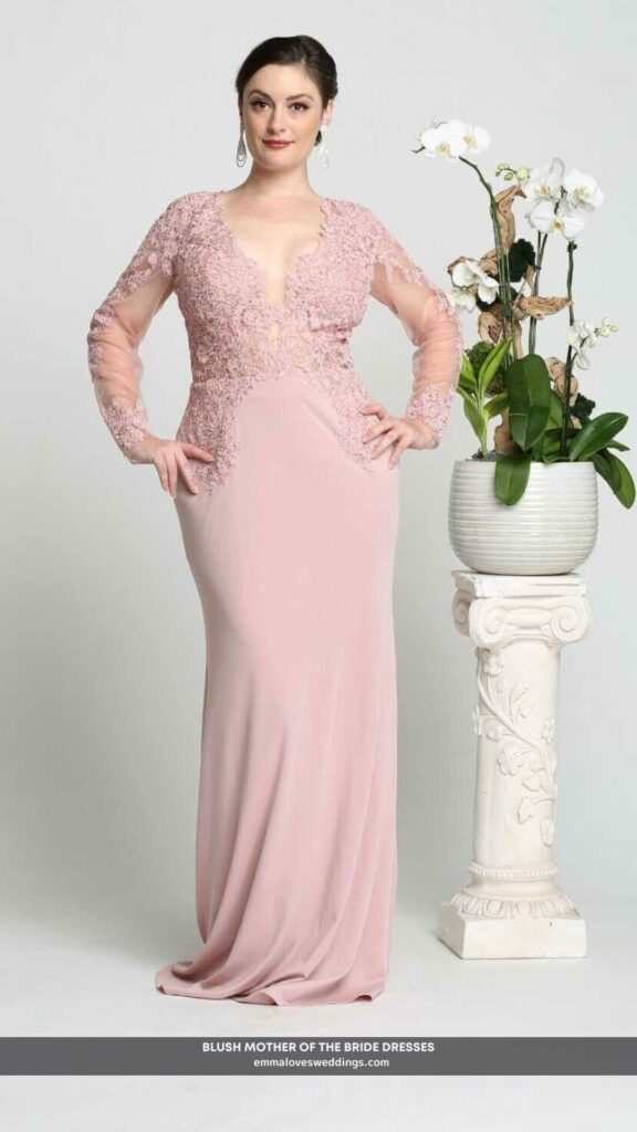 A mother of the bride dress with long sleeves and a deep v-neckline in a soft blush color.