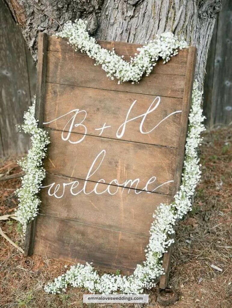 A wooden sign with a wreath of flowers draped around it creates a fanciful, almost fairytale-like welcome.