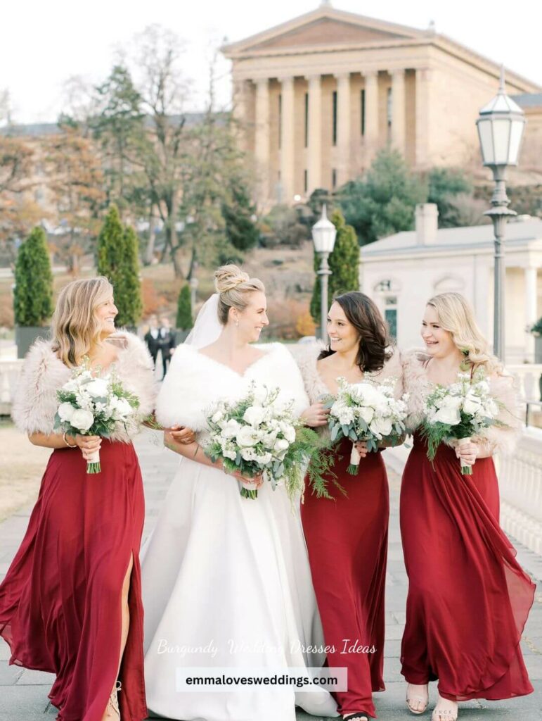 Beautiful burgundy bridesmaid dress with a faux fur wrap in neutral tones perfect for a winter nuptial wedding.