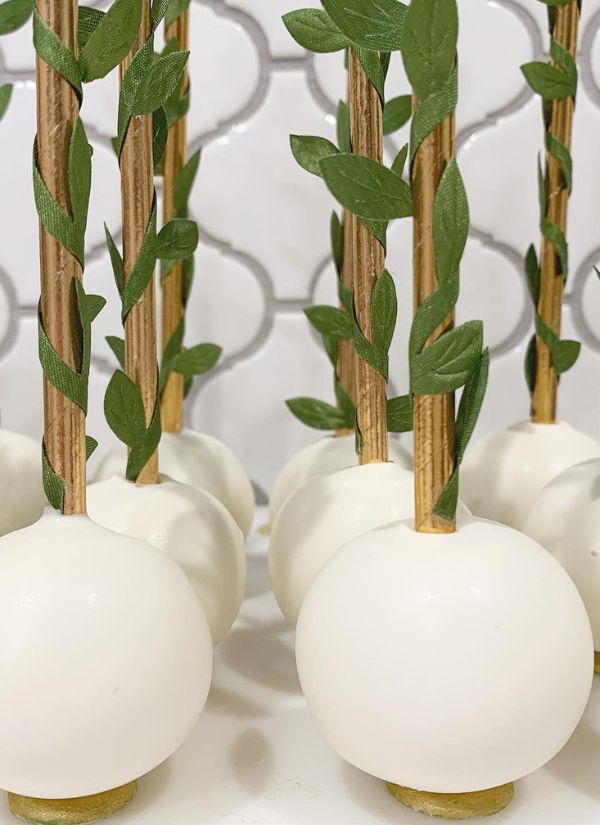 Elegant wedding cake pops prove that you don't need a confection covered in glitz to appear stunning—just look at this creation.