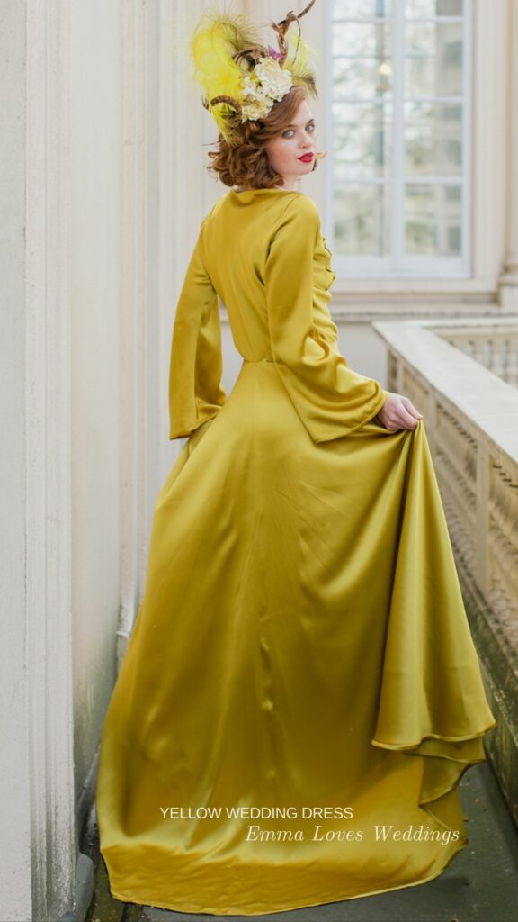 For a daring look choose this bright yellow silk A line wedding dress with dramatic long sleeves.