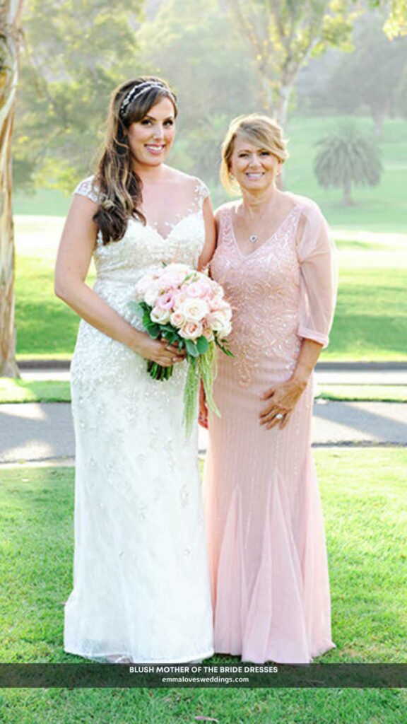 Her glam is complemented by the blush mother of the bride dress.
