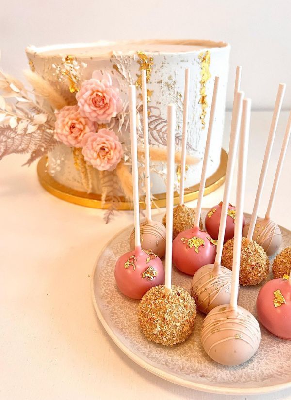 I adore these pink cake pops with matching cake and gold dusted decorations.