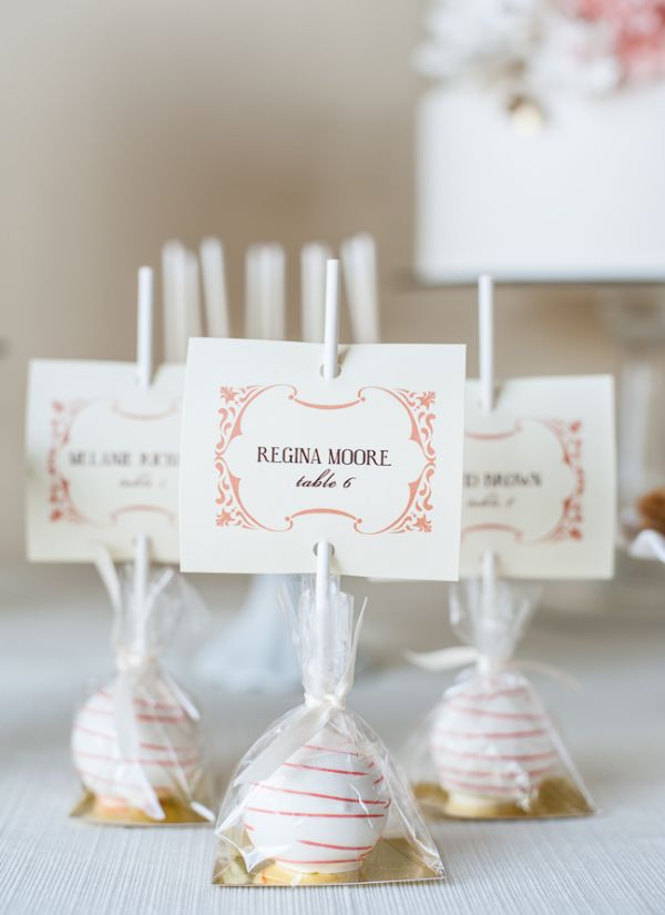 It's a sweet idea to have cake lollipop escort favors delivered to each guest's seat at the table.