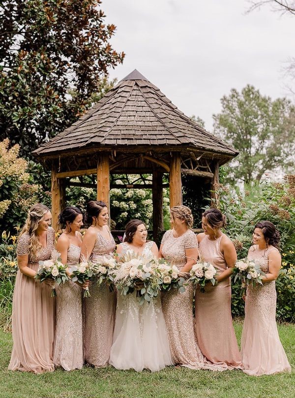 The champagne bridesmaid dresses with the scoop backs and sequins are absolutely stunning.