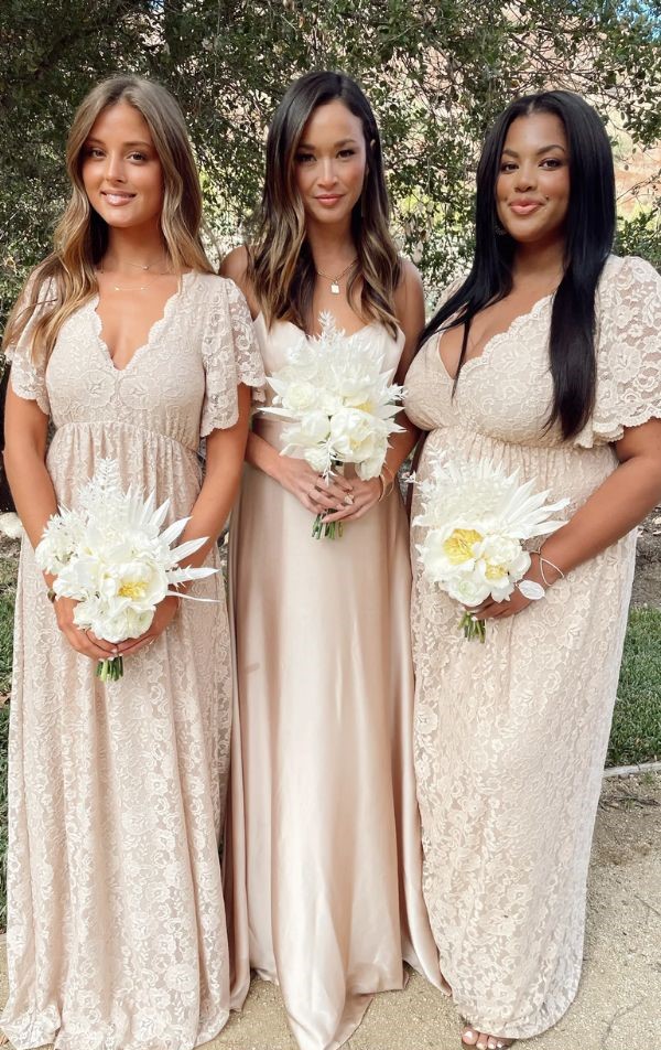 This champagne and lace maxi bridesmaid dress features a scalloped neckline and an elastic waist for extra comfort and flattery.