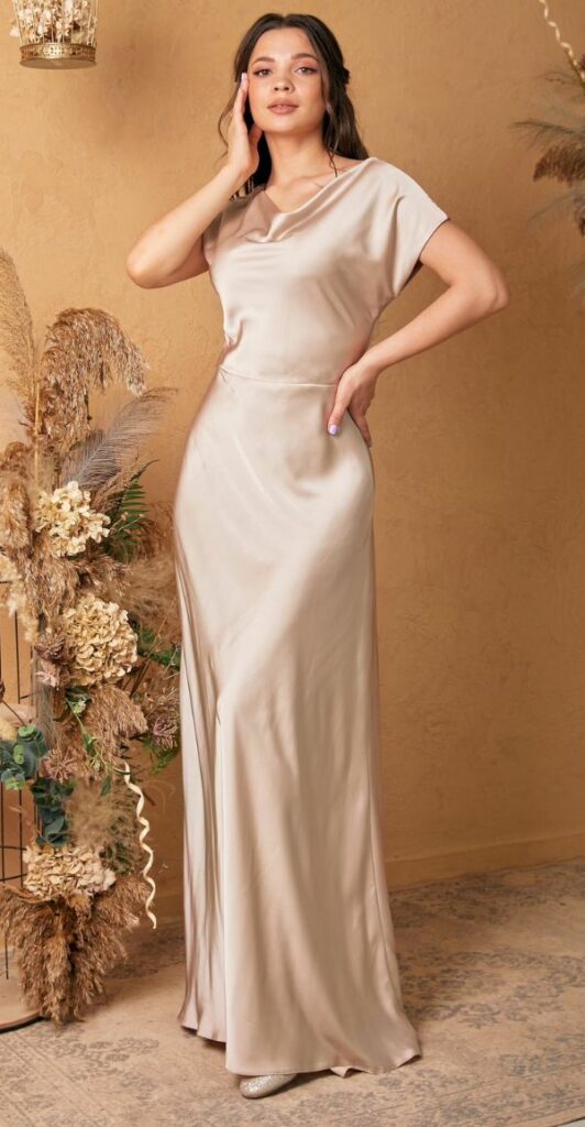 This champagne silk bridesmaid dress with floor length dress with a train is stunning