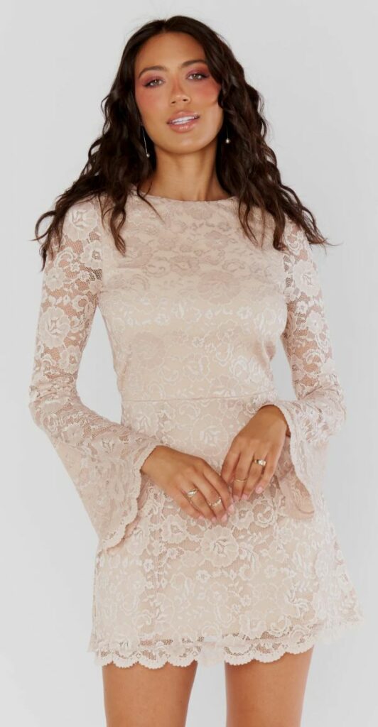 This short lace champagne dress is perfect for a bridesmaid. Pair it with heels and delicate jewelery to complete the look.