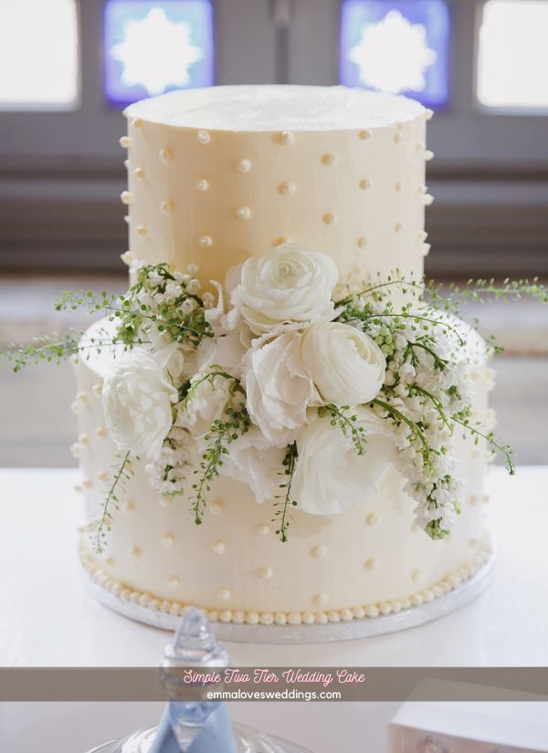 This two tiered simple wedding cake is the epitome of timeless elegance