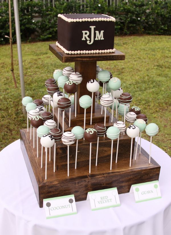 Your guests will have a great time enjoying these three tiered cake pops in a variety of flavors at your wedding.