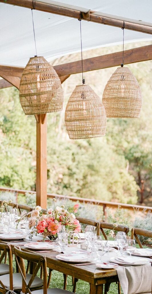A stunning idea for any outdoor wedding is to use rattan pendant lights at the reception.