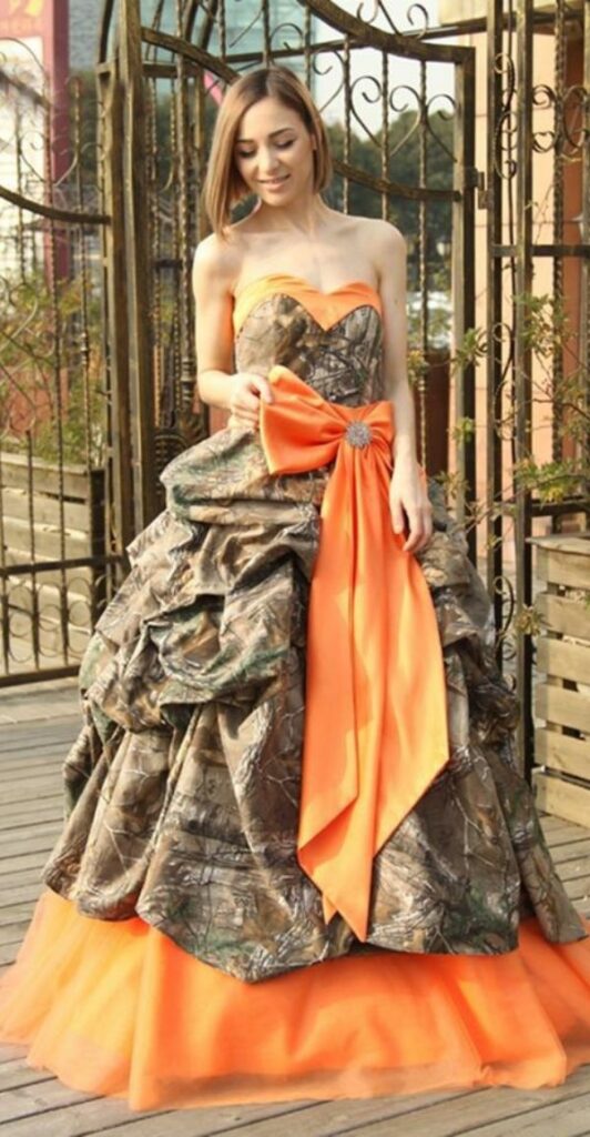 Cheap plain camo wedding dresses can be made even more unique with the addition of some colorful flower embellishments.