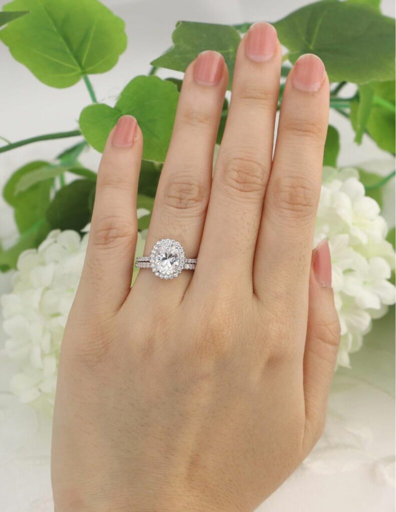 Elegant and stunning art deco halo engagement ring with matching wedding band.