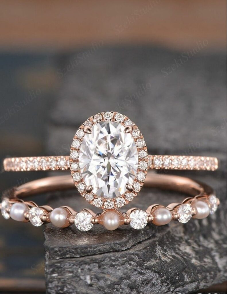 Specifically made to match your wedding band this oval cut moissanite engagement ring is crafted in radiant rose gold.