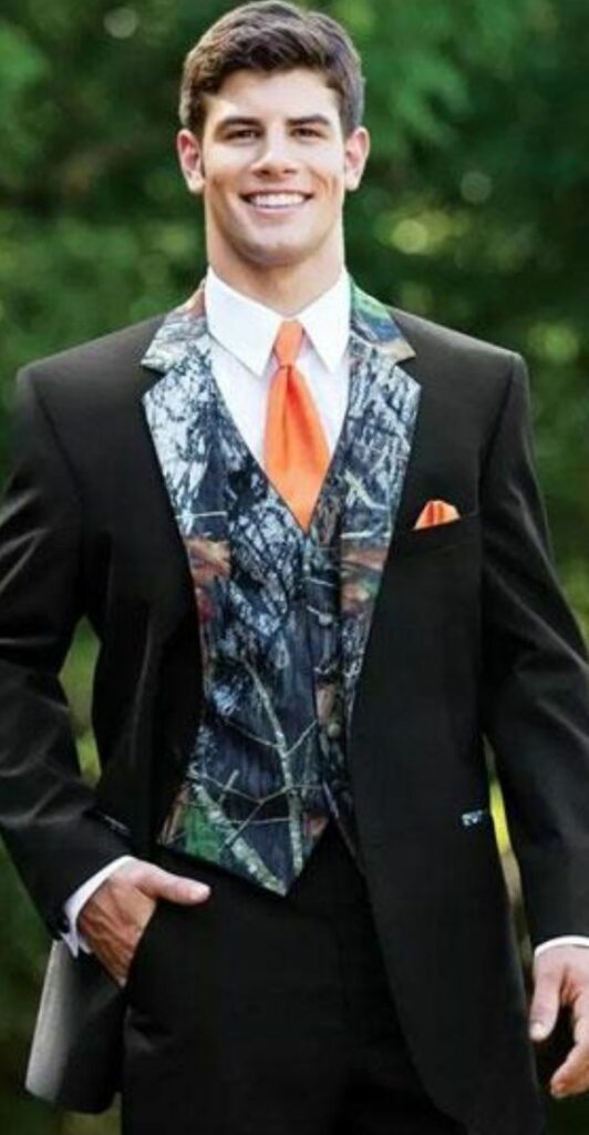 This orange tied full sleeve camo wedding tuxedo is a perfect choice for the groom.