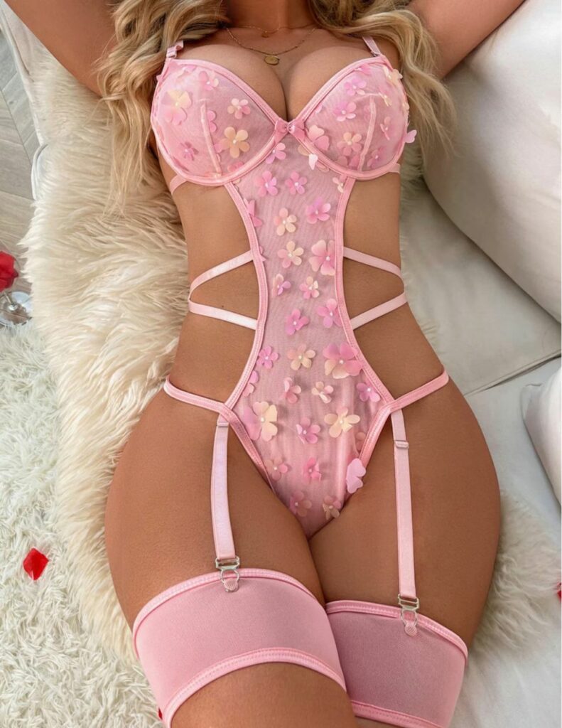 This set of rosy pink lingerie for Valentines Day includes a bra and thong with an adjustable garter belt and leg straps for a night you and your special someone won't soon forget.