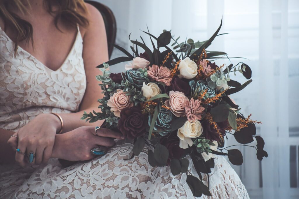 This natural, boho bridal bouquet with dark, saturated colors has a moody, romantic feel that we adore.