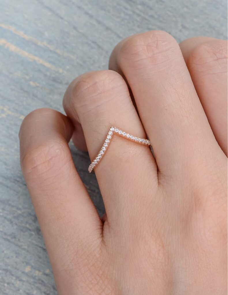 Your oval engagement ring will look beautiful next to this v shaped rose gold chevron band.