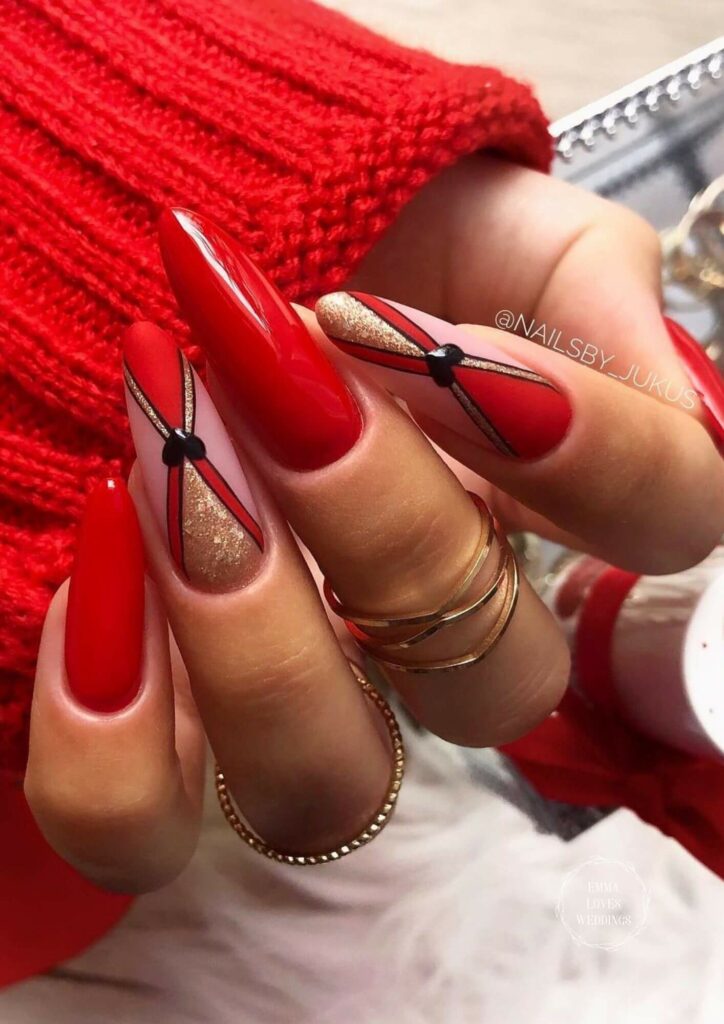 A bold red nail art design with gold accents could be a beautiful and festive choice for Valentines Day