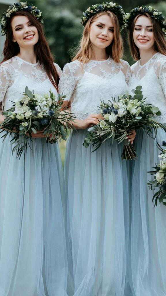 A lovely idea for a rustic wedding is a dusty blue lace bridesmaid dress with sleeves.