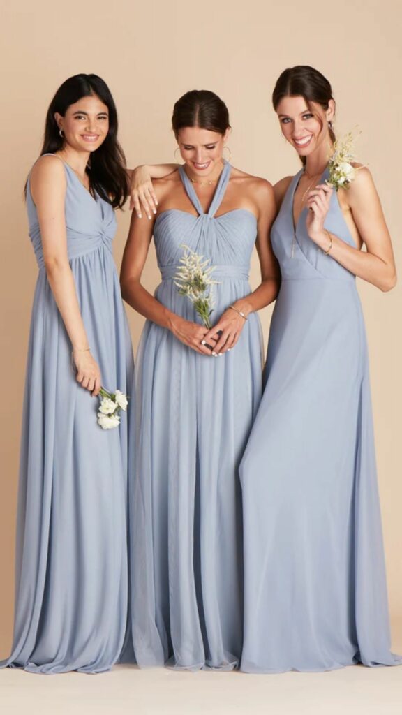 Airy and long this dusty blue tulle bridesmaid dress can be styled in a variety of ways.
