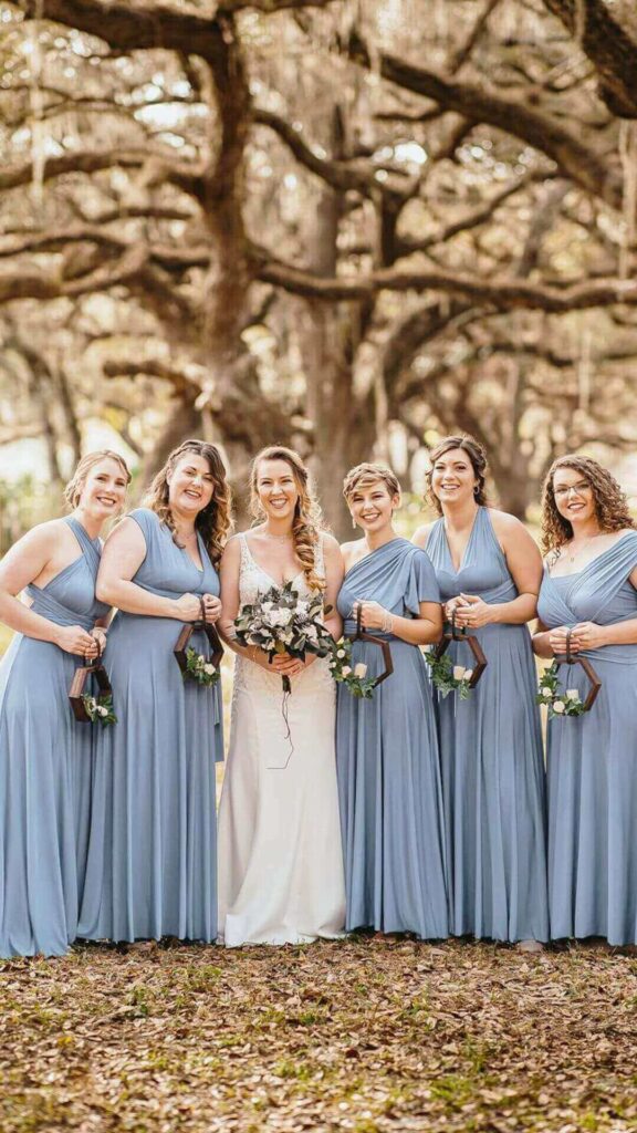 An elegant and versatile choice for any bridal party these long dusty blue bridesmaid dresses are a show stopping addition to any wedding.
