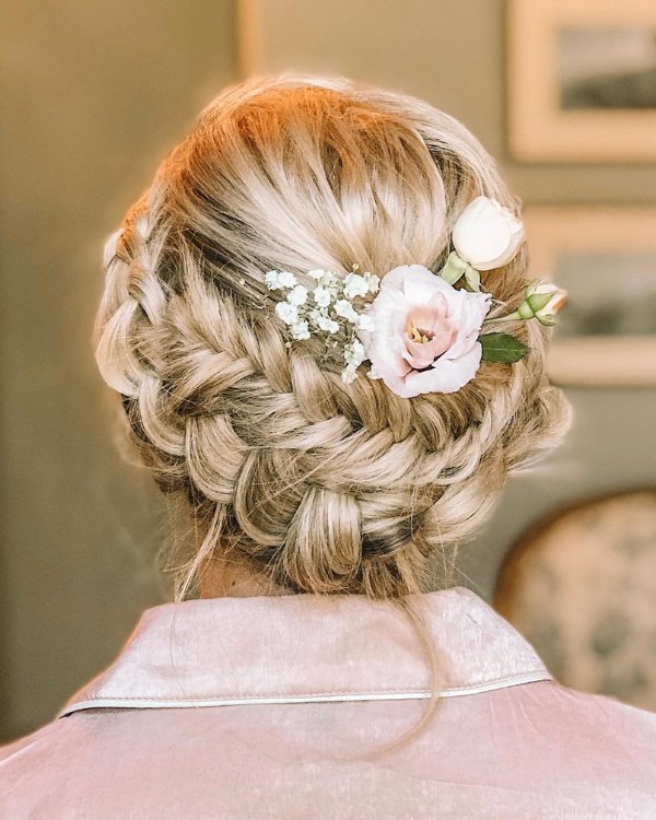 Braided wedding hairstyles for short hair are lovely and those adorned with fresh flowers are ideal for boho brides.