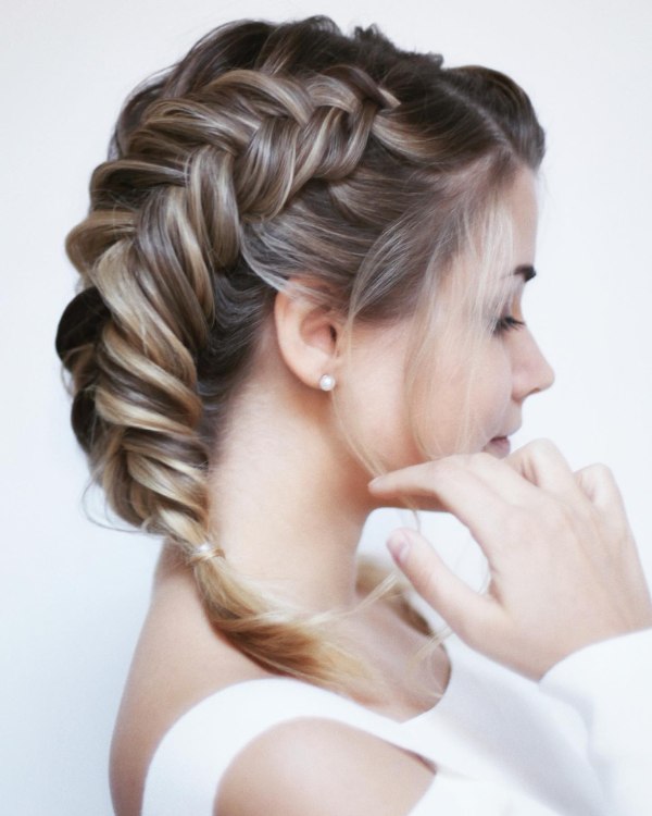 Braids are a beautiful addition to a bride's short hairstyle because they make the bride appear more delicate cute and girly.