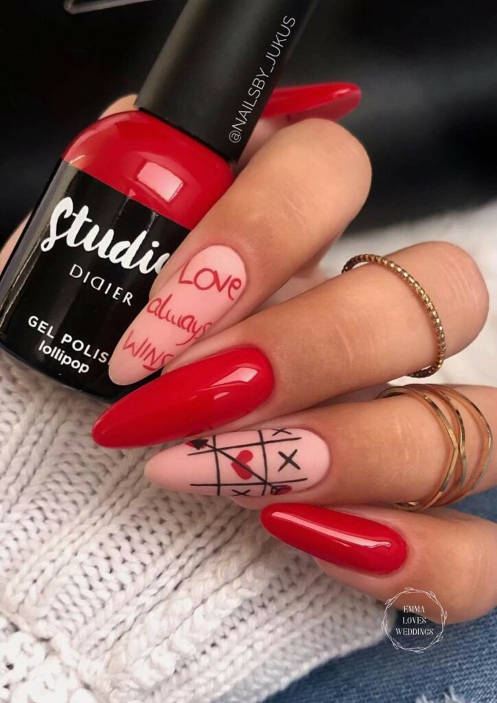 Cute Pink and red valentine nail design with love note love always wins