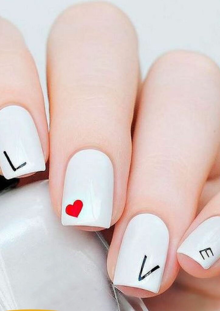 Design that spells out "LOVE" is a cute and unique Valentine's Day nail art idea