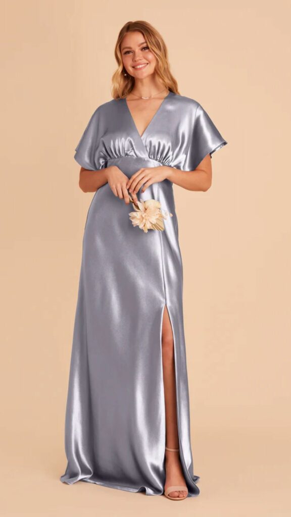 Elegance is easy to attain with a satin dusty blue bridesmaid dress bodice featuring a deep V neckline kimono sleeves.