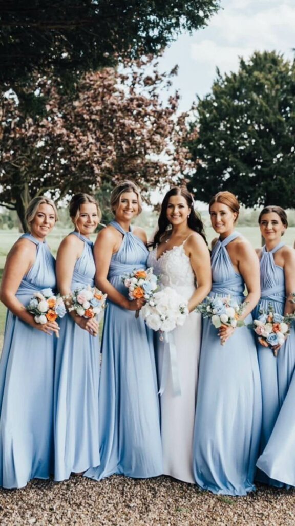 Elegant and comfortable this long dusty blue bridesmaid dress is fashioned from a stretchy jersey fabric that flows freely at the waist.