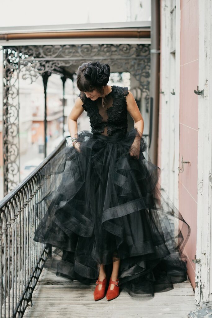Express your individuality in this sexy black wedding dress and bold red heels.