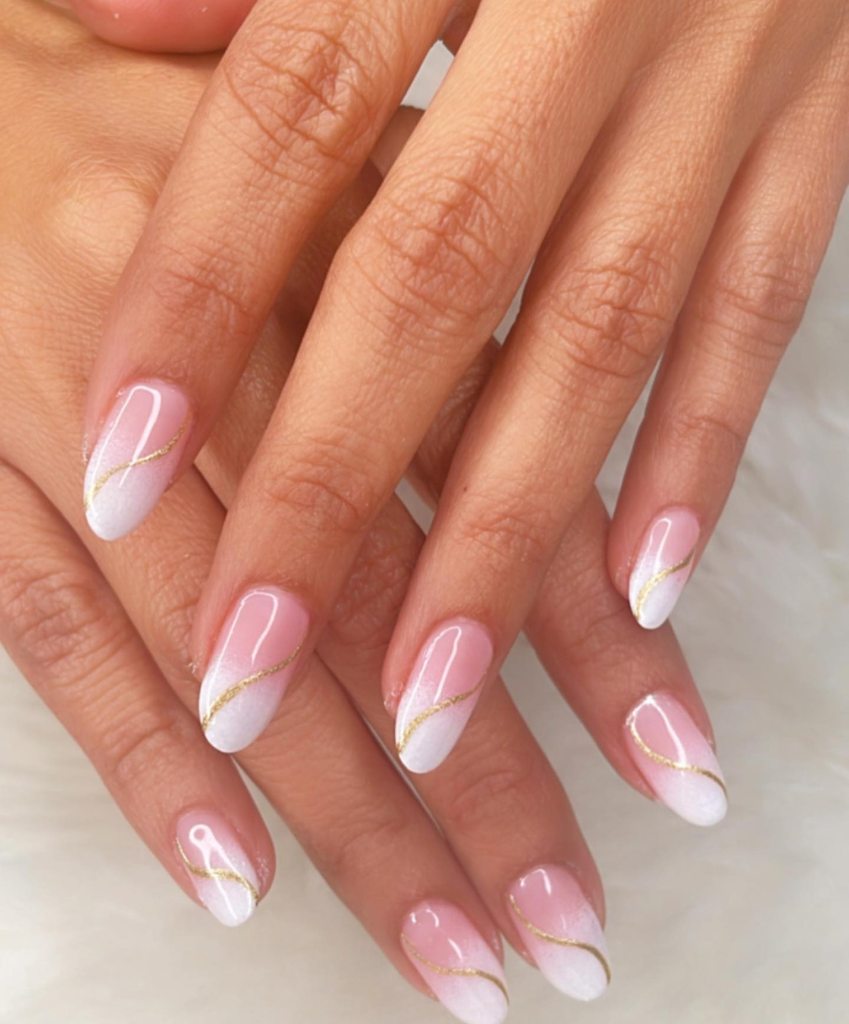 Having gold art on pink and white ombre wedding nails is just stunning.