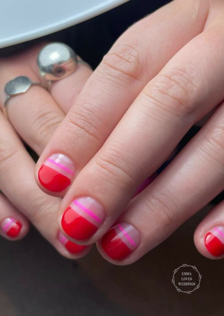 Make a bold statement with this short red and pink DIY Valentine's Day nails