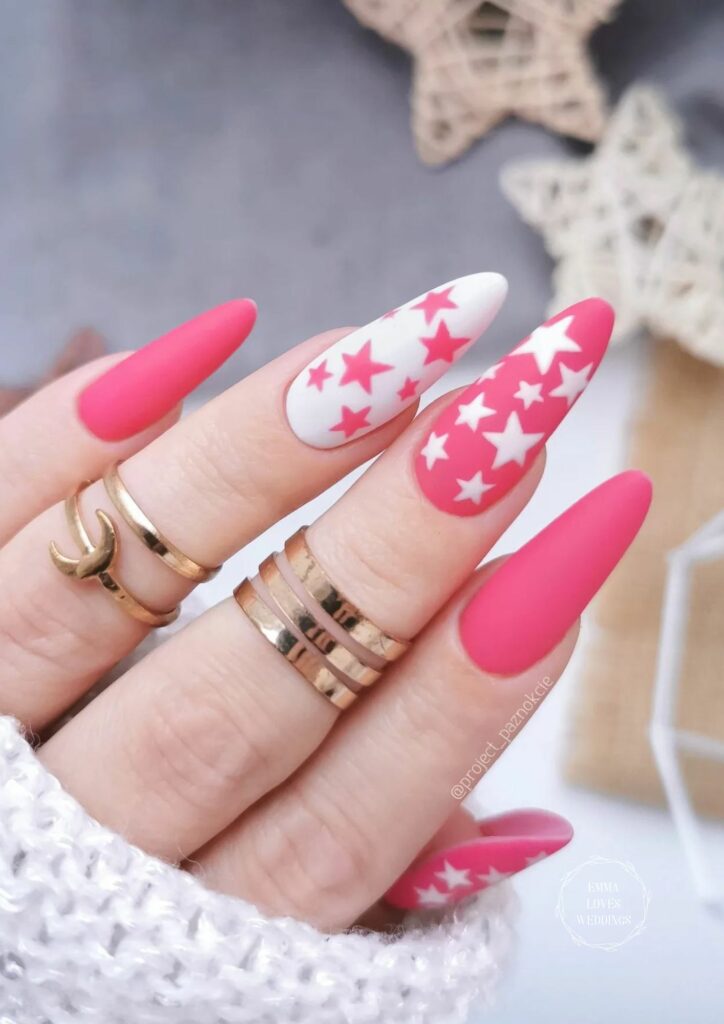 Put some whimsy into your cute Valentine's Day nail design by painting some stars on your nails.