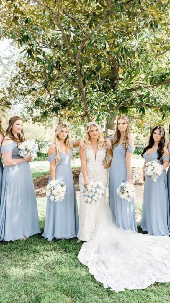 This long dusty blue bridesmaid dress with detachable sleeves that button on and off is a chic idea for the minimalist.