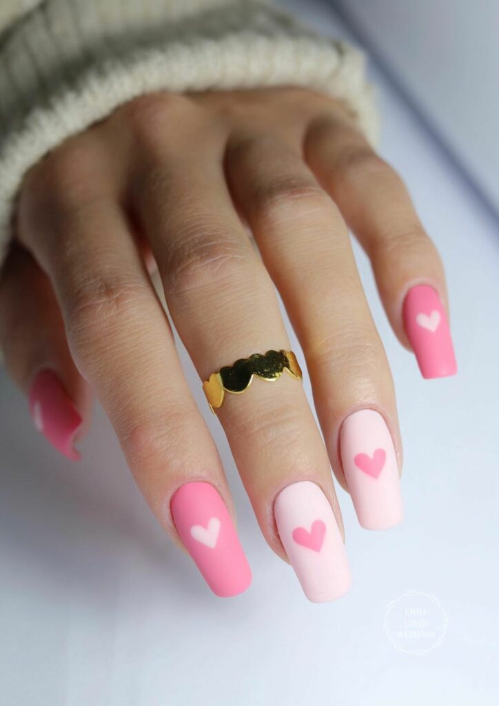 You don't have to be a nail artist to make these cute pink valentines day nails