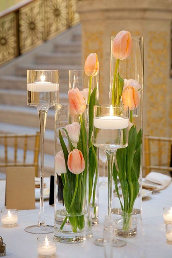Add a burst of vibrant color and celebrate the arrival of spring with this stunning tulip floating candle wedding centerpiece