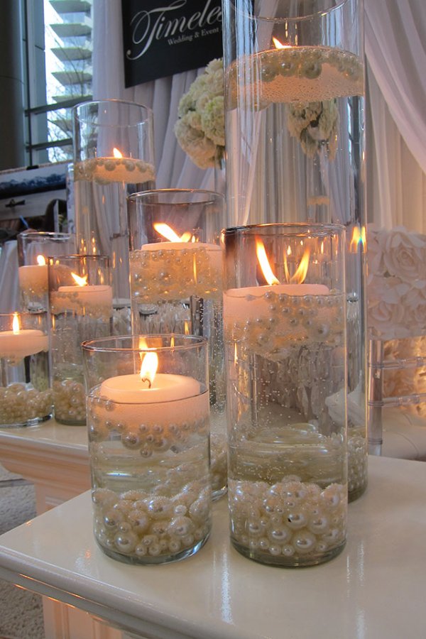 Adding pearls to your floating candle centerpieces gives them a classic elegant touch.