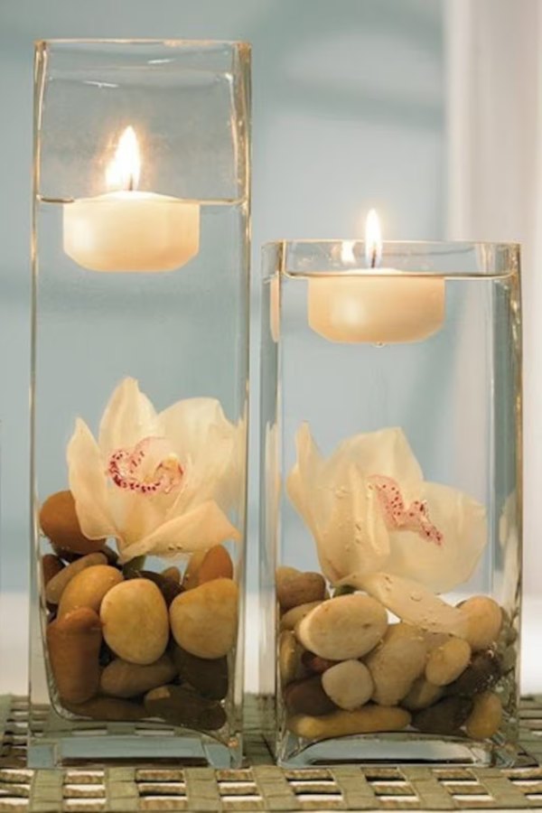 Create a dreamy and luxurious ambiance for your wedding with these exquisite gemstone floating candle centerpieces in ivory hues.